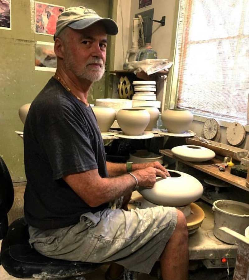 Michael Adcock at the potter's wheel